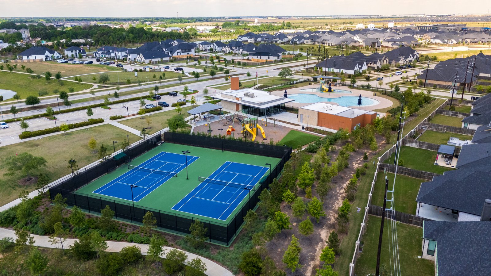 Tennis Courts, Playground, and Swimming Pools at Cross Creek Ranch in Fulshear TX